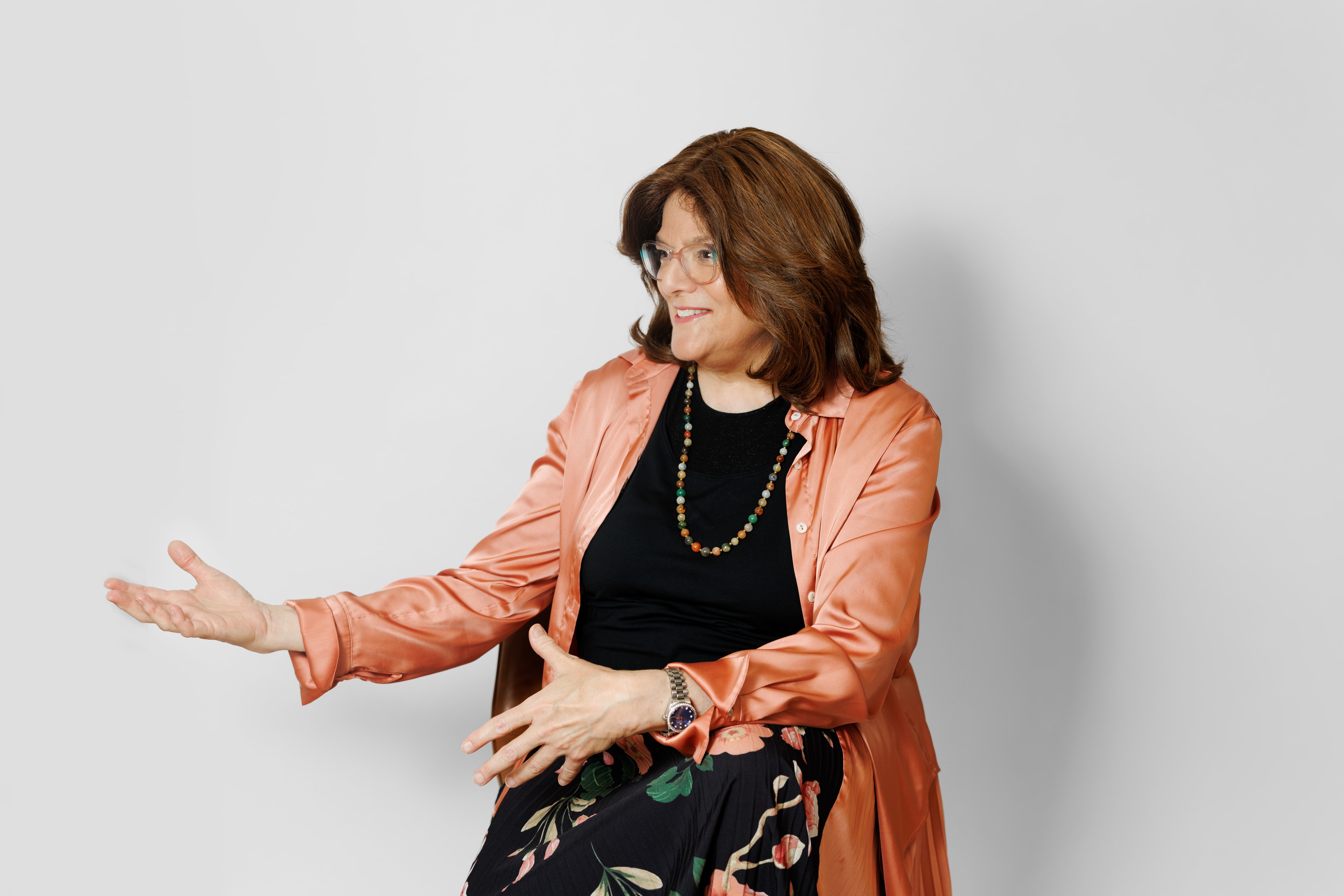 Judy gesturing warmly during a career coaching session